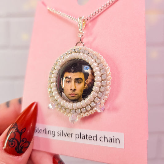 Luigi Mangione White Beaded Necklace