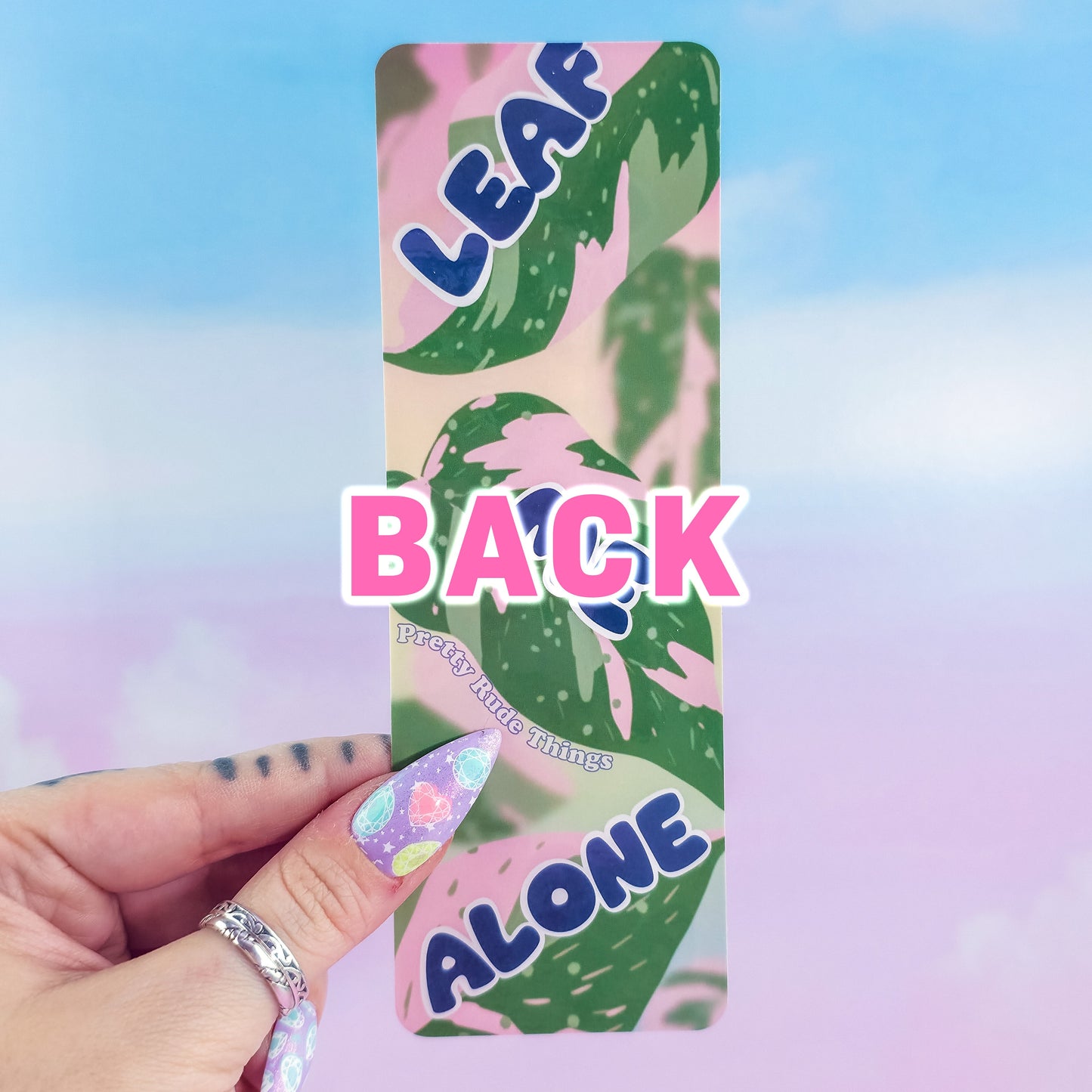 Back of holographic Leaf Me Alone bookmark – glossy laminated pink princess philodendron leaves, handmade by Pretty Rude Things