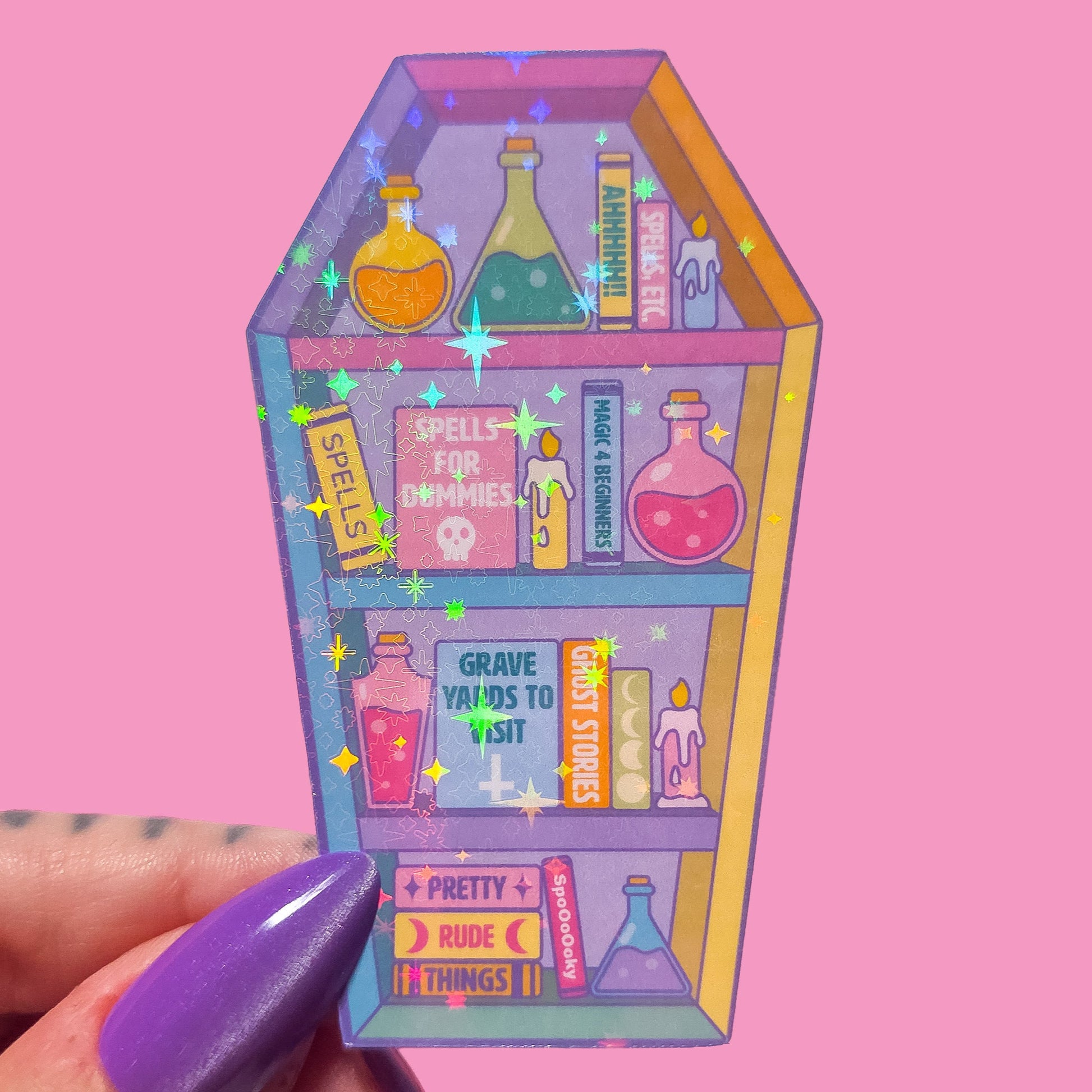 Coffin shaped bookcase sticker with potion bottles and books on a pink background