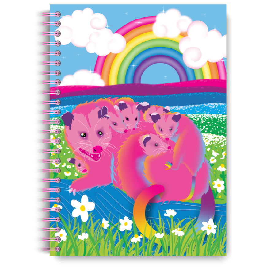 Notebook cover with pink animal characters and a rainbow on a blue background