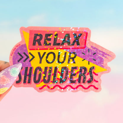 Sticker with 'Relax Your Shoulders' text held by a hand against a colorful background